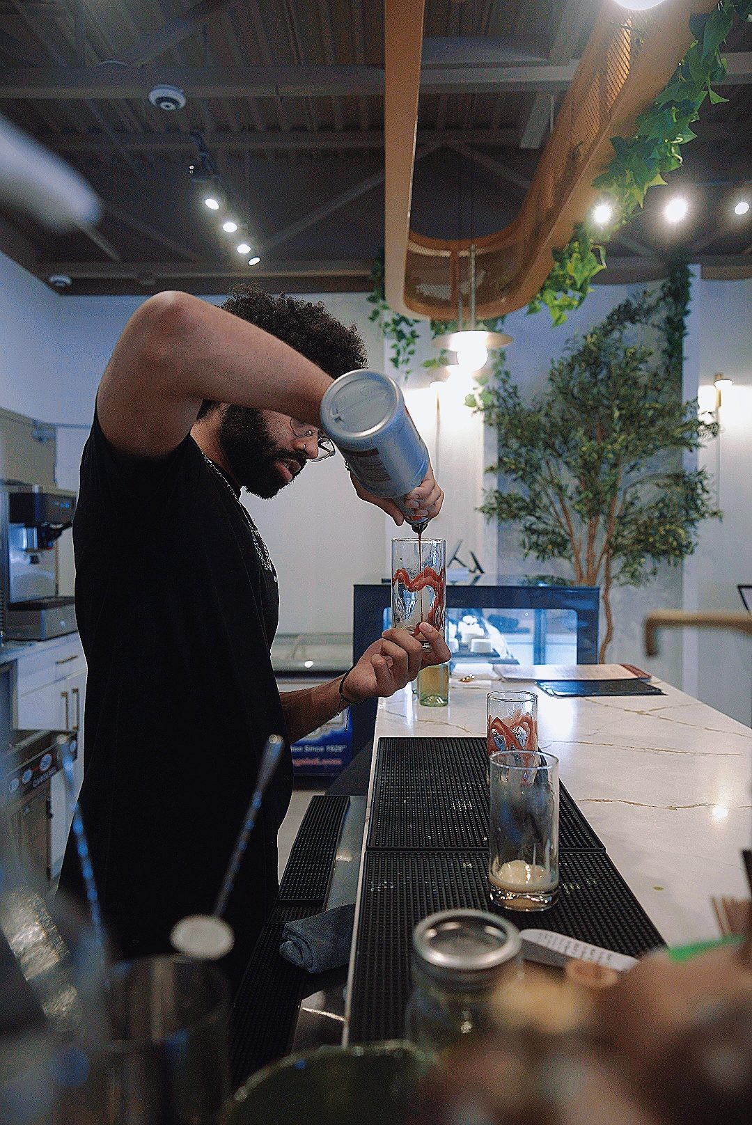 Barista pulling a shot behind the counter